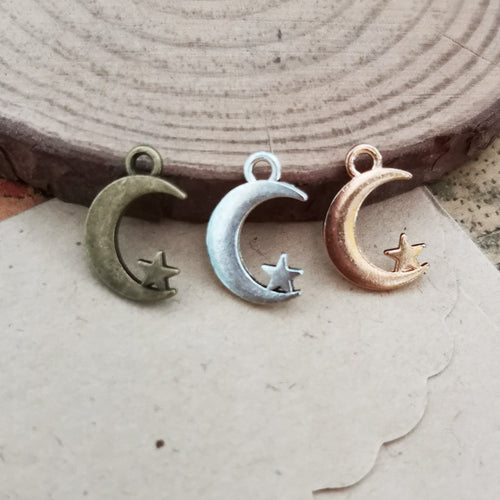 Crescent Moon and Star Metal Charm shown in grouped finish view