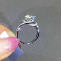 Swirl Halo Round Stone Ring In Polished Silver Tone view 3