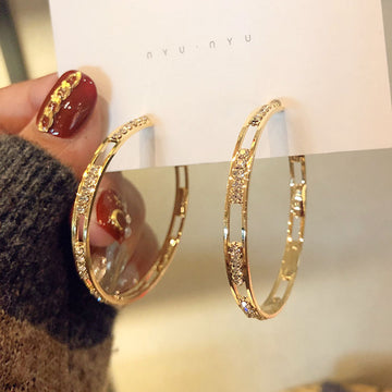 Gold Geometric Hoop Earring Collection with Sculpted Polished Metal Details