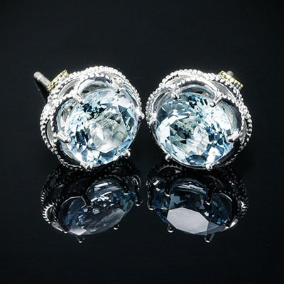 Light blue hexagonal CZ studs with silver micro-set frames on black background