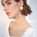 Matte Gold Dome Stud Earrings with Sculpted Polished Metal Details view 4