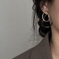 Two Tone Oval Hoop Earrings with Sculpted Polished Metal Details view 3