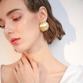 Matte Gold Dome Stud Earrings with Sculpted Polished Metal Details view 2
