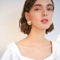 Matte Gold Dome Stud Earrings with Sculpted Polished Metal Details view 3