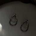 Two Tone Oval Hoop Earrings with Sculpted Polished Metal Details view 4