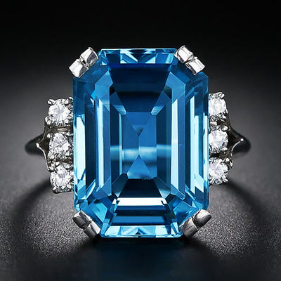 Product view showing silver-tone oversized aqua rectangular solitaire cluster ring