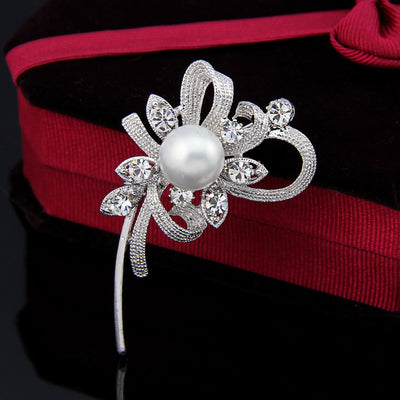 Front product view of the flower brooch pin in black and red