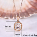 Clear Oval Halo Pendant Necklace in Rose Gold Tone view 5