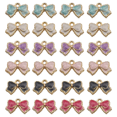 Colorful bow and butterfly charms arranged on a light background