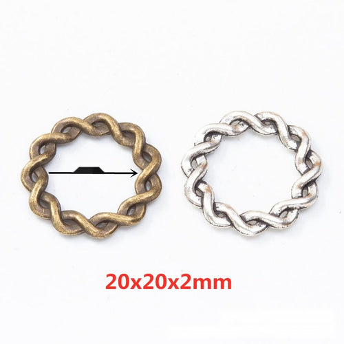 Assorted braided round links arranged together on a white background