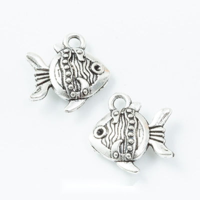 patterned tropical fish metal charm in antique silver finish shown together in the available finishes