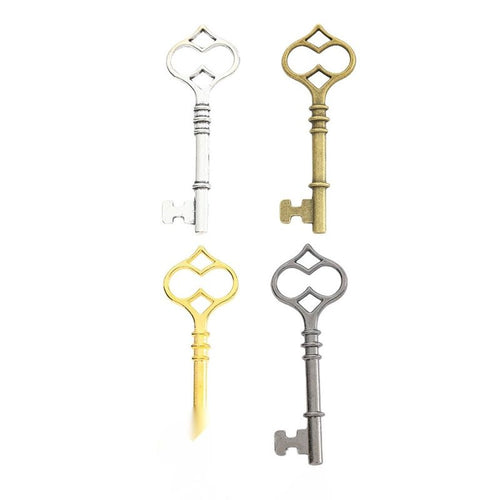 Overview of heart-top key charm pieces on a white background