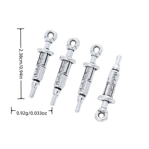 Antique Silver syringe charm shown in product image 1