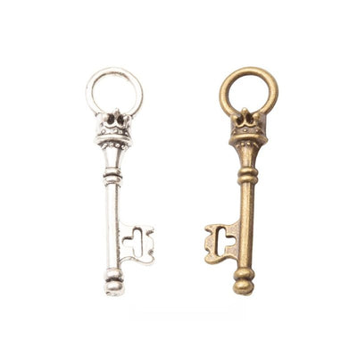 Vintage Skeleton Key Metal Charm Pendant shown in the available visible finishes