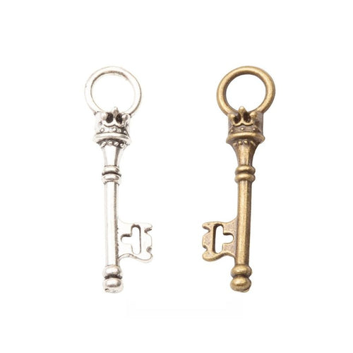 Vintage Skeleton Key Metal Charm Pendant shown in the available visible finishes