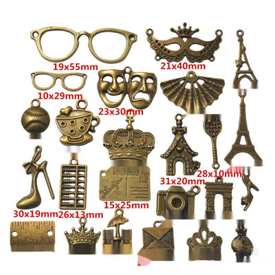 Product view of mixed charm assortment showing a mixed assortment of travel, fashion, theater, sport, camera, crown, and