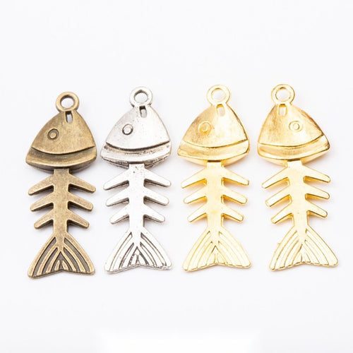 Front display of jointed fish skeleton charm shown against a plain background.