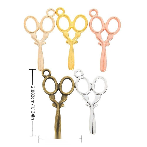 Overview of the scissors charm in the available metal finishes