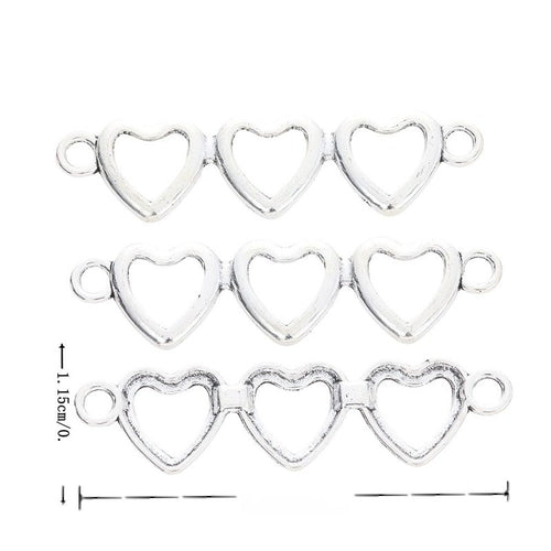 Three linked open hearts with a loop at each end shown in arranged finish comparison