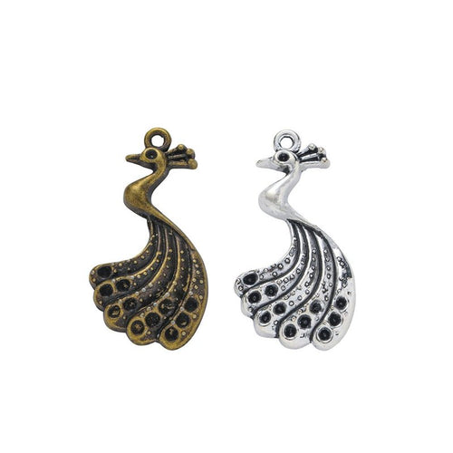 Openwork Peacock Charm shown in all pictured finishes on a white background