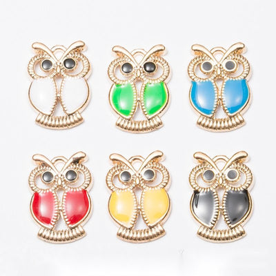 Enamel Owl Charm grouped finish options on a white background