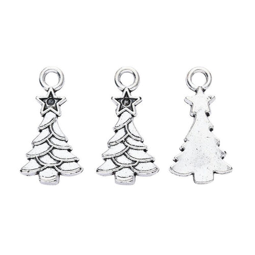 Front-facing arrangement of openwork Christmas tree charms on a white background