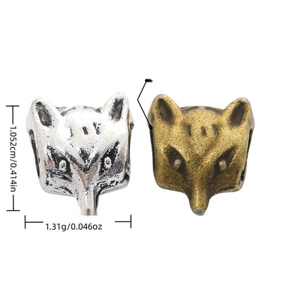 Front view of fox head large-hole bead showing finish variation 1