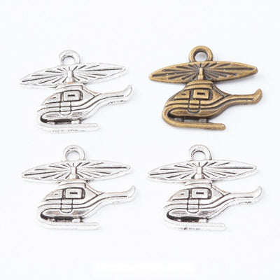 side view helicopter metal charms in two antique finishes shown together in the available finishes
