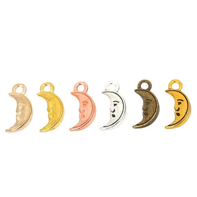 Product photo 1 of the smiling crescent moon charm highlighting its curved crescent face with cutout eye and smile detai