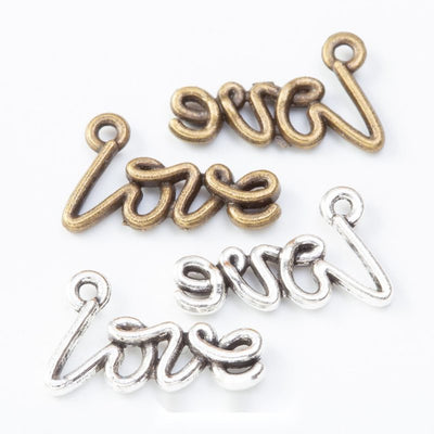 Group view of the love script charm showing the available finishes and front details