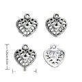 Antique Silver Openwork Heart Charm with Floral Scrollwork view 1