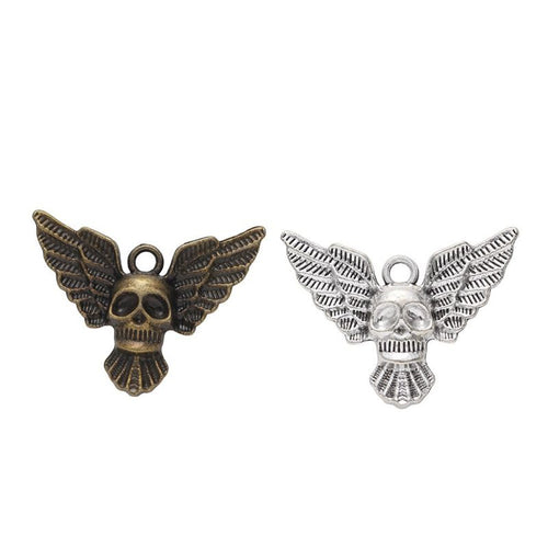 winged skull metal charm shown from the front in the available metallic finishes