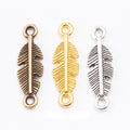 Double Loop Feather Connector Charm in Three Metal Finishes view 1