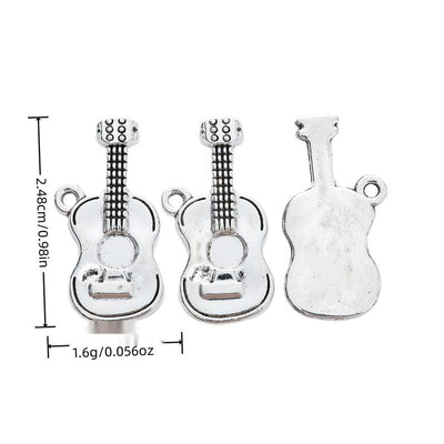 Front view of acoustic guitar charm showing finish variation 1