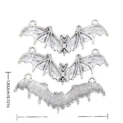 Front and reverse views of three flying bat charms with measurement and weight guides