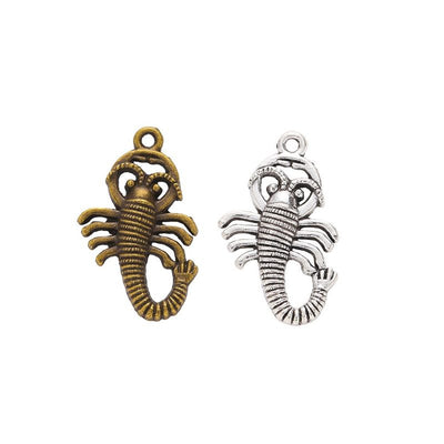 Finish comparison of 蜈蚣 charm on a white background