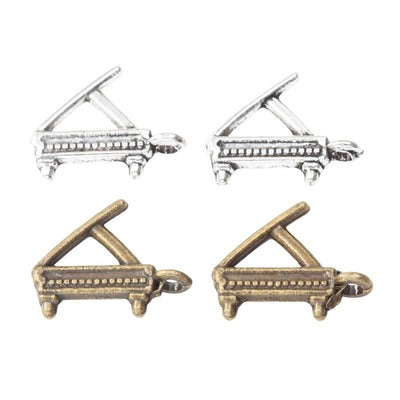 Grand piano metal component, grouped front view on white