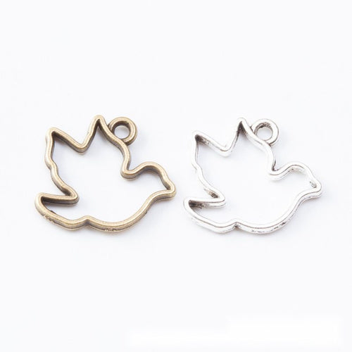 Front display of open bird silhouette bezel charm shown against a plain background.