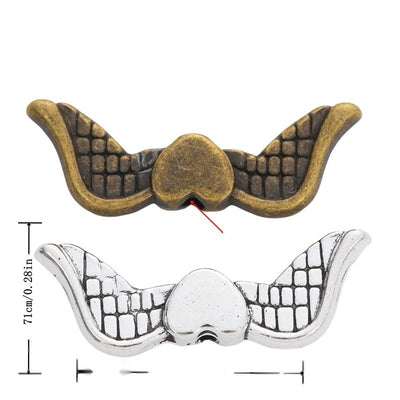 Front view of heart-wing spacer bead showing finish variation 1