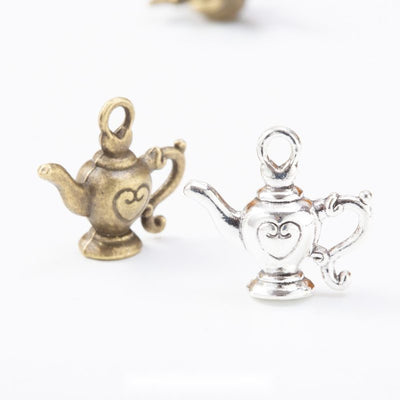 Overview of heart teapot charms in the available designs and finishes