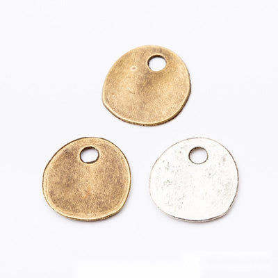 Round Blank Tag Charm finish comparison on a white background