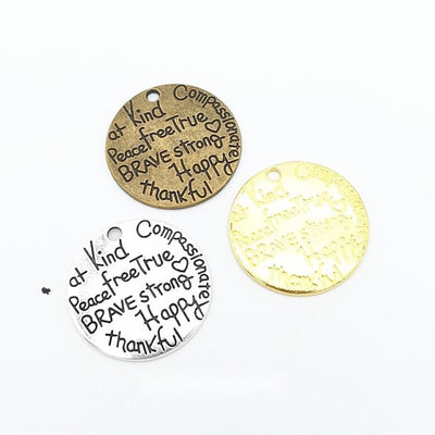 Kindness Word Art Disc metal piece shown in Antique Bronze, Gold, Antique Silver