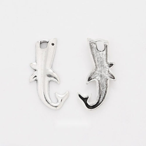 Curved Shark Charm shown in all pictured finishes on a white background