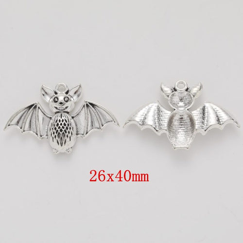 Wide Wing Bat Charm finish assortment on a white background