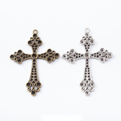 Grouped front views of ornate cross charms