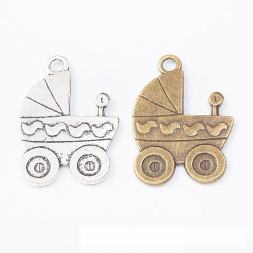 Group view of the baby carriage charm showing the available finishes and front details