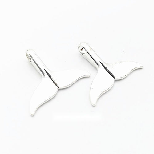 Whale tail charm shown in grouped front views