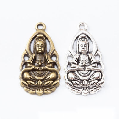 Group view of seated Guanyin figure framed by a decorative halo