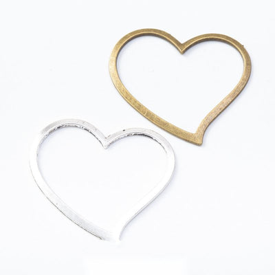 Group view of a slim open heart outline forms a simple jewelry link component
