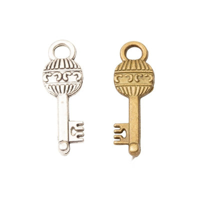 Front and finish comparison of ornate key charm